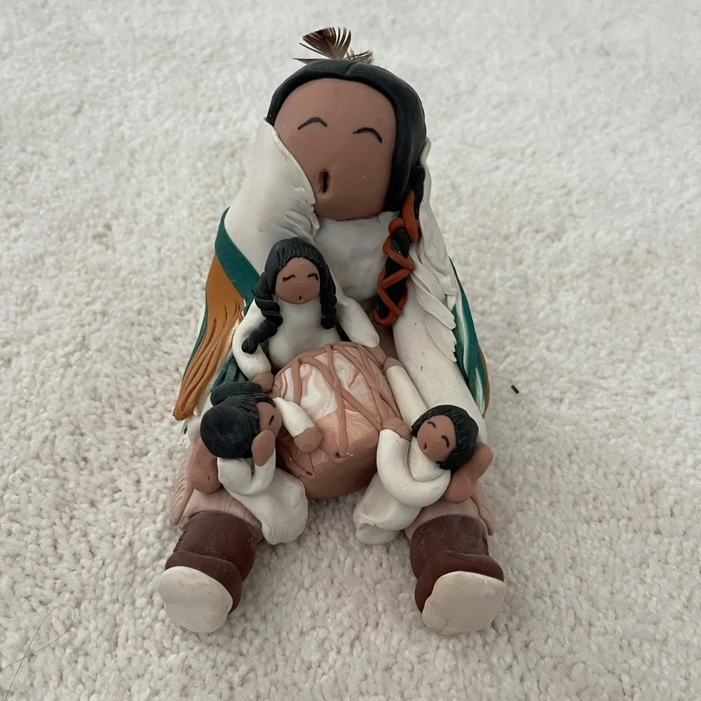 Signed piece of Native American clay folk art